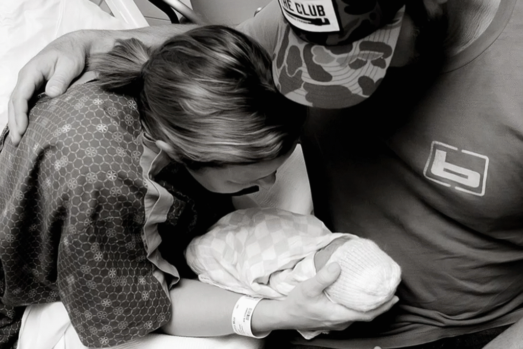 Alex and Drake White holding the baby