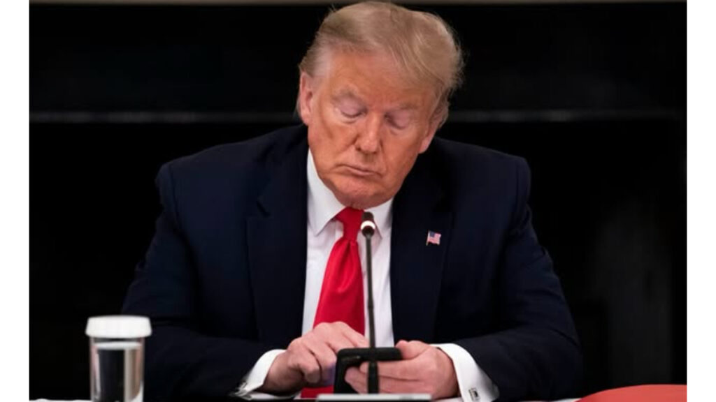 Donald Trump using his phone.