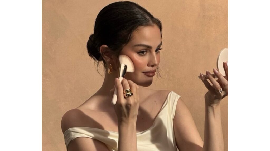 Selena Gomez applying blush.