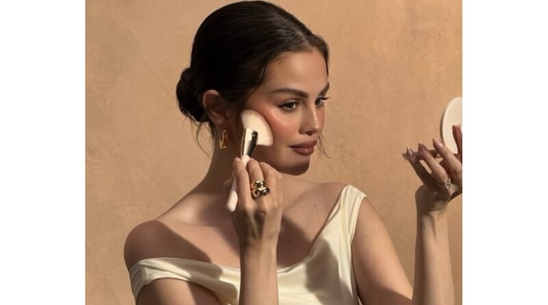 Selena Gomez applying blush.