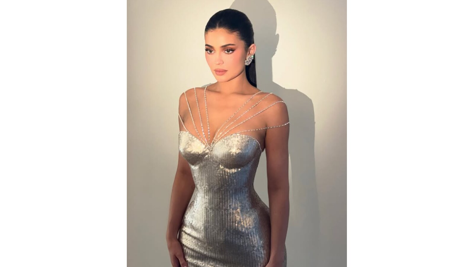 Kylie Jenner wearing a beautiful silver dress.