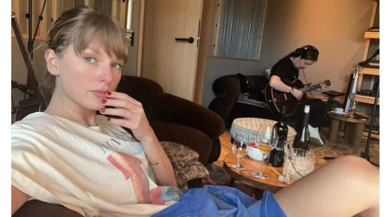 Taylor Swift sitting in a studio.