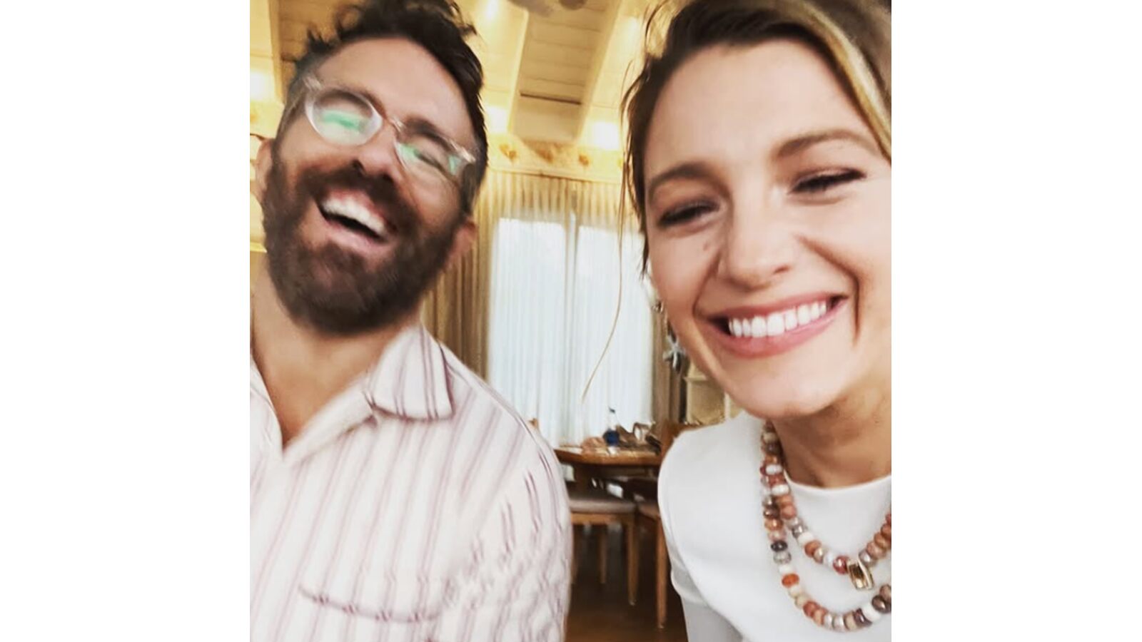 Blake Lively and Ryan Reynolds laughing together.