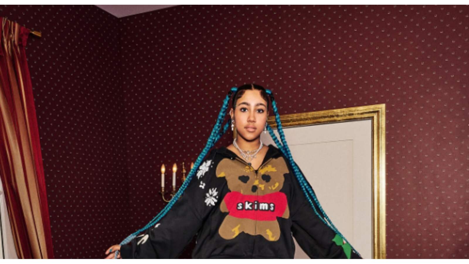 North West wearing SKIMS hoodie.
