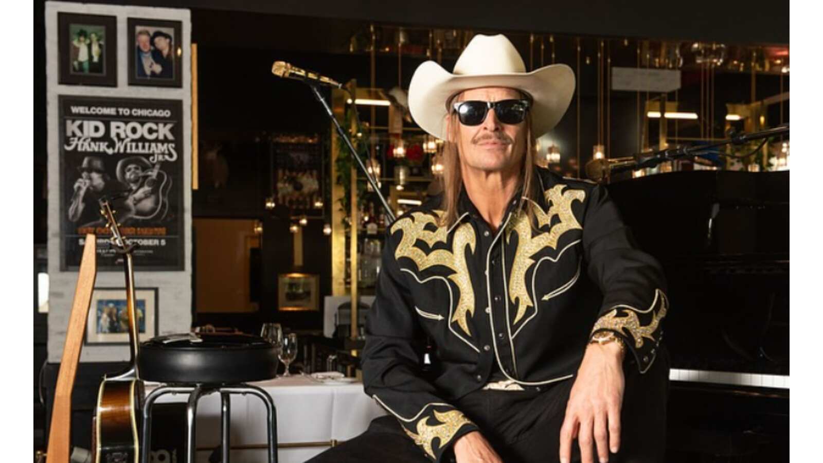 Kid Rock sitting in The Detroit Cowboy Restaurant.