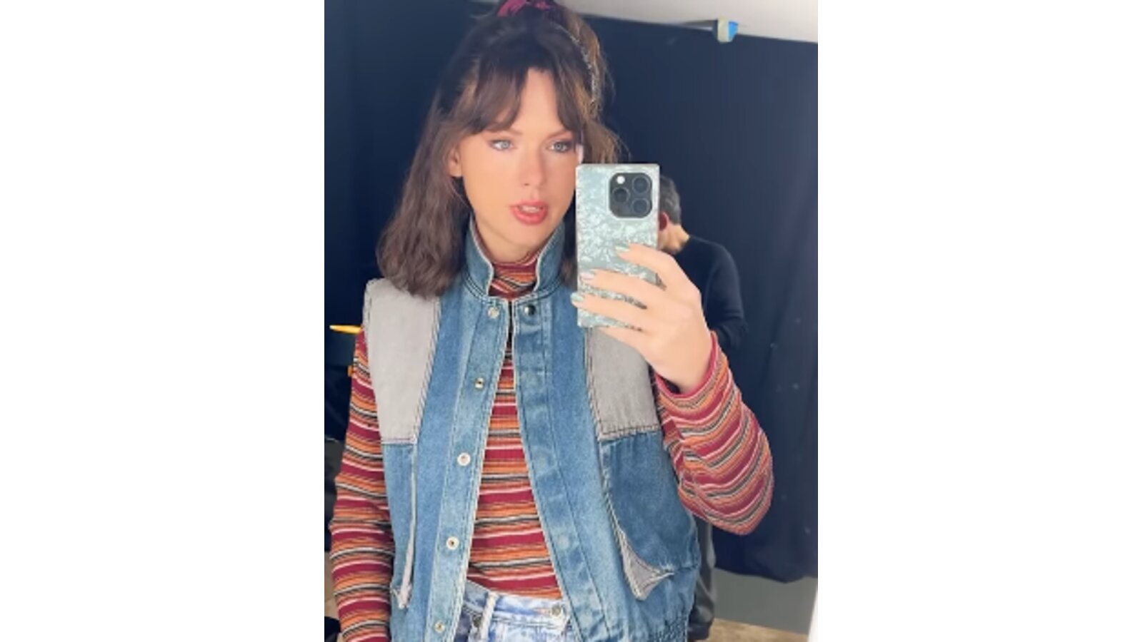 Taylor Swift wearing a brown wig and 1980s-inspired costume for the shoot.